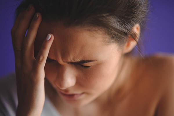 young woman with migraine image