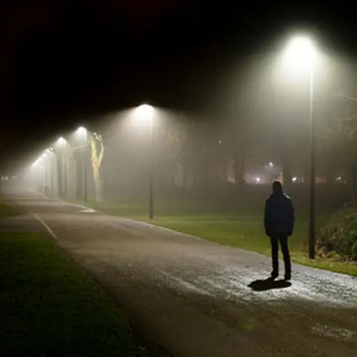 man on the street alone at night image