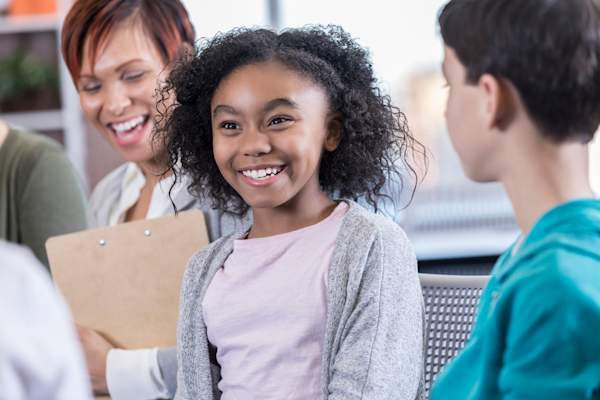 smiling girl in group therapy