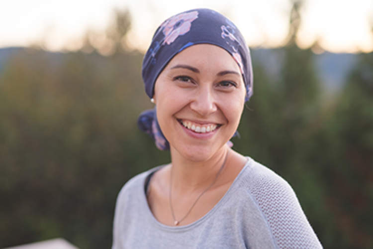 Woman with cancer smiling.