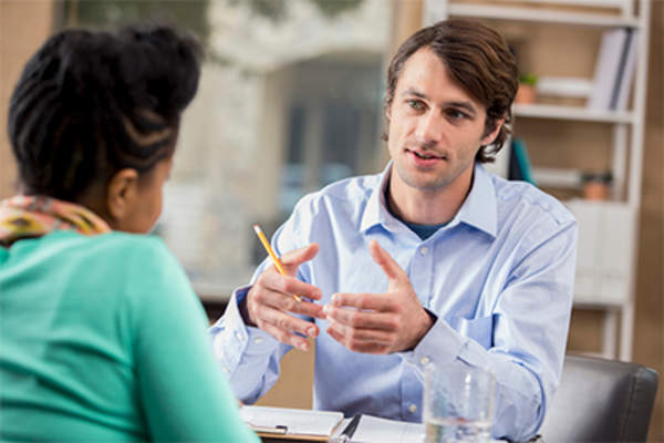 Doctor talking to female patient.