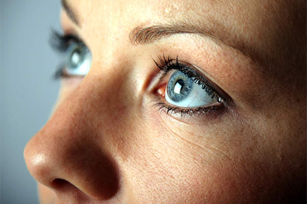 Close up of woman's blue eyes.
