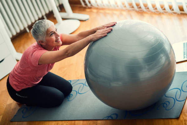 Stretching with exercise ball