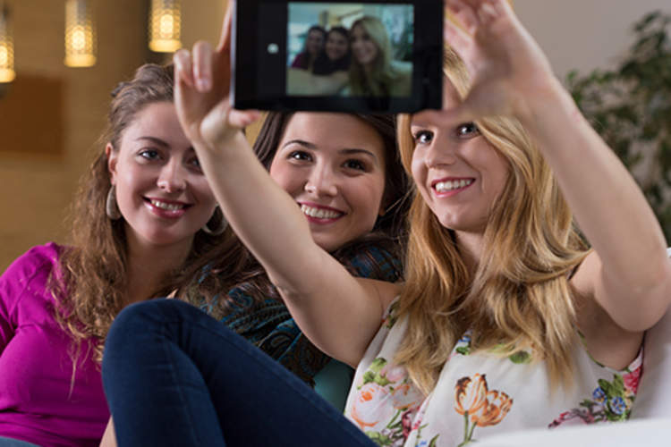 Friends taking a selfie together.