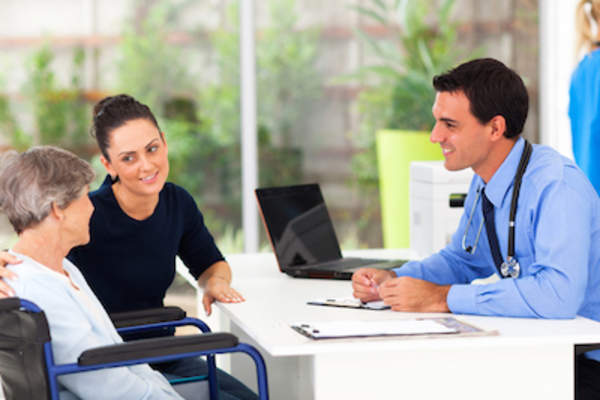 Dermatologist talking to patient about treatment options.