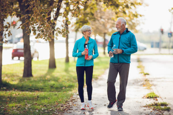 Couple walking for exercise.