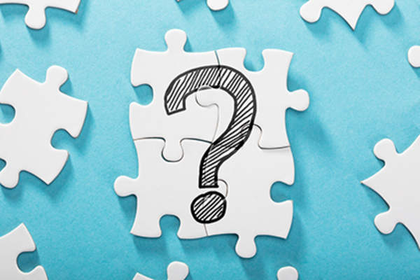 Question mark on puzzle pieces.