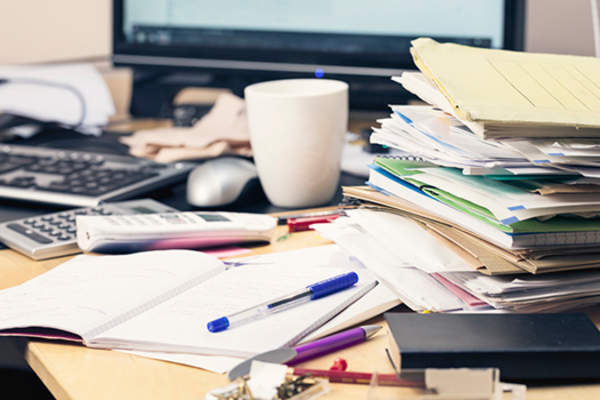 cluttered desk image