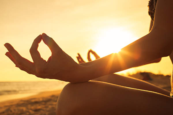 Touching fingertips together during meditation.