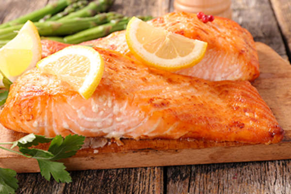 Baked salmon fillet on board.