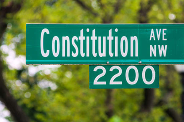 Constitution Ave street sign.