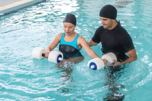 Walking in pool with float weights.
