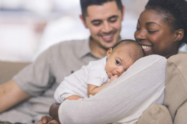 Mother and father with newborn.