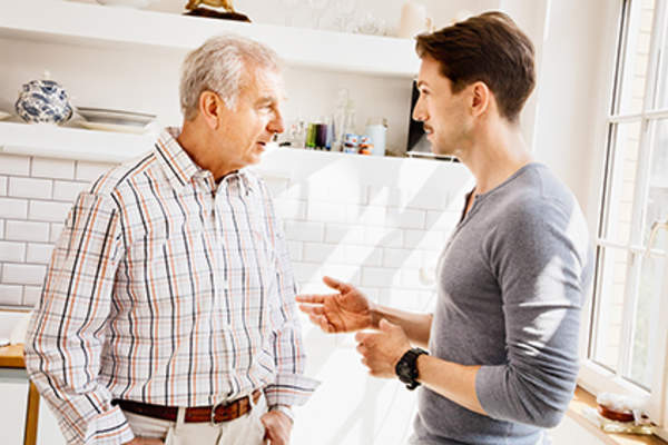 Son explaining ulcerative colitis to his father.