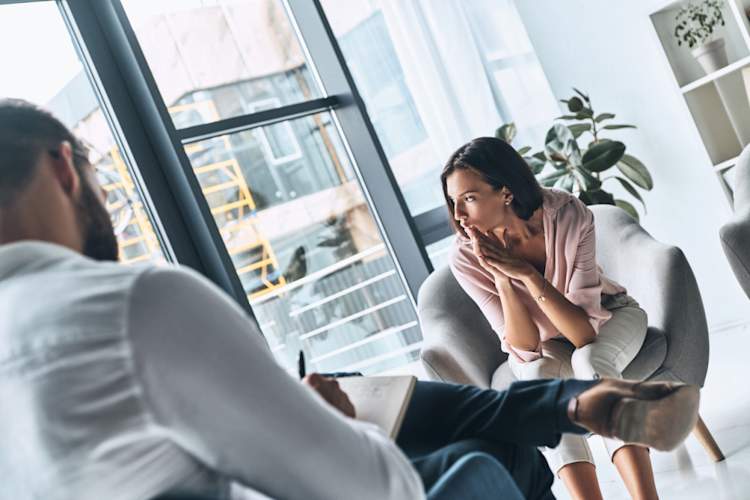 therapist talking to woman