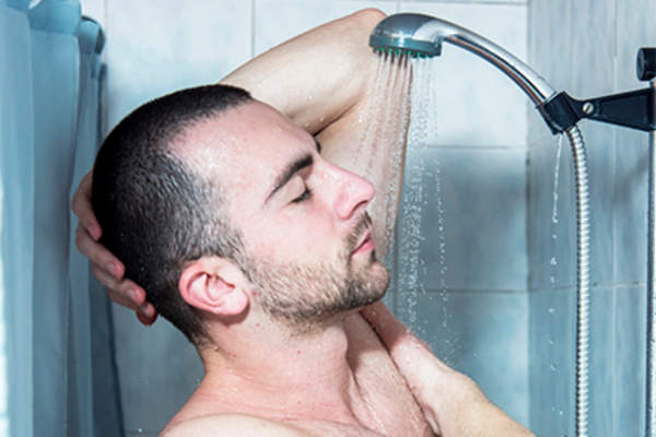 Man taking a shower.