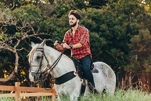 Man riding horseback.