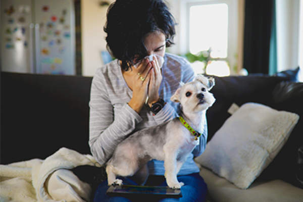Woman with dog allergy.