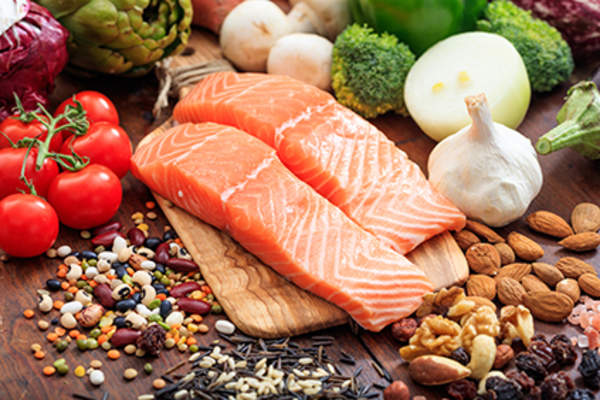 Salmon with fruits, vegetables, and legumes.