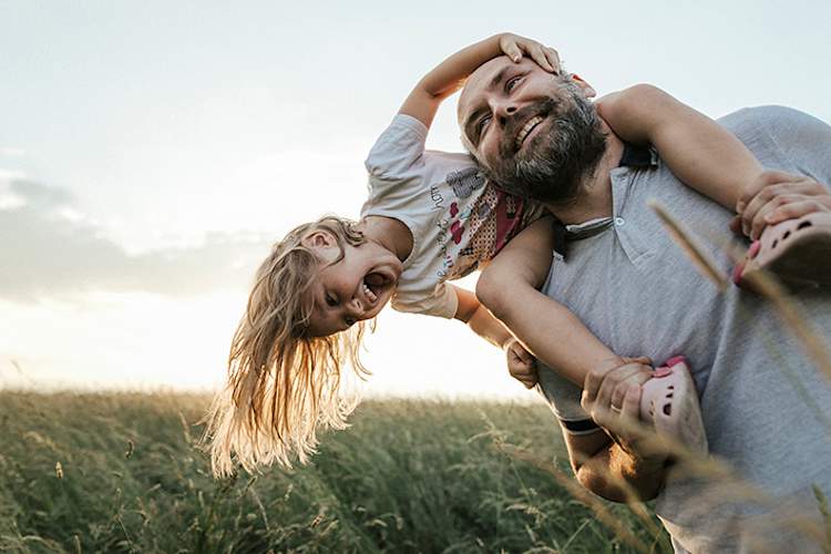 Father and daughter playing outside