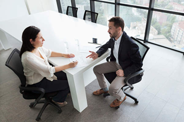 Man and woman having business meeting.