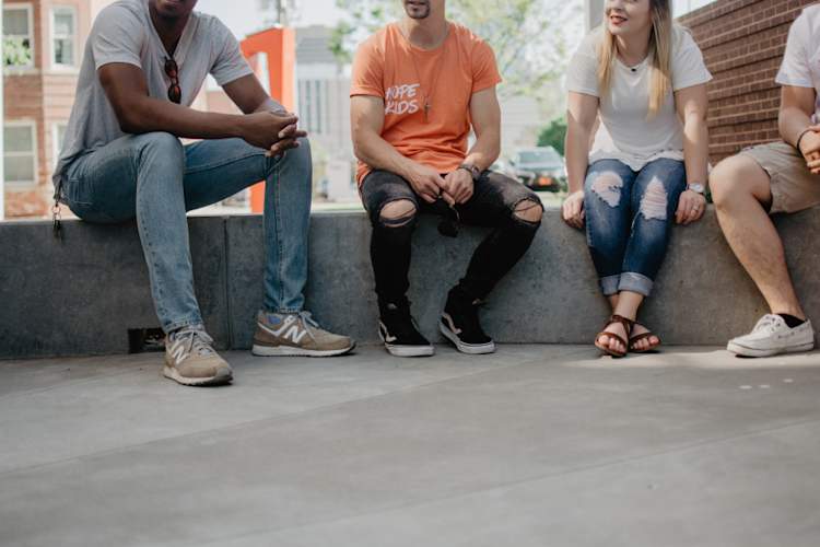 group of friends sitting together and talking