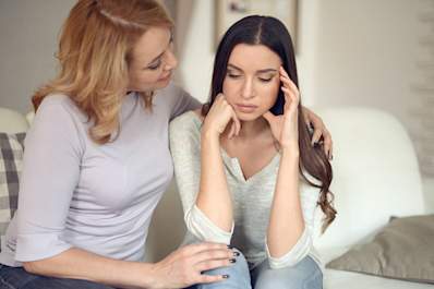 Mother talking to teen daughter about depression.