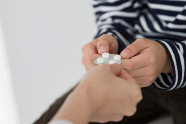 Doctor giving patient sample medication.