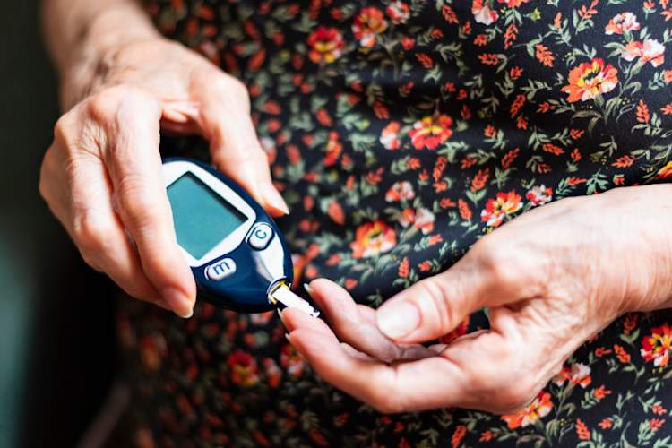 senior woman tracking her glucose levels.