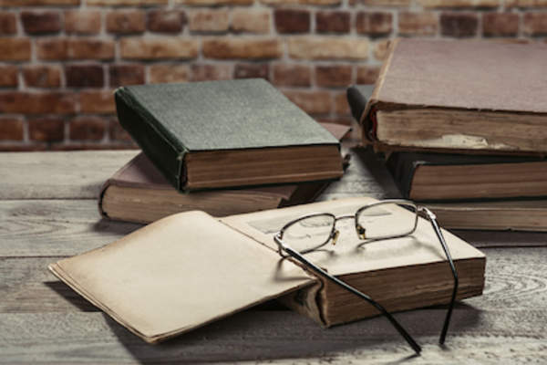 Old glasses on old book.