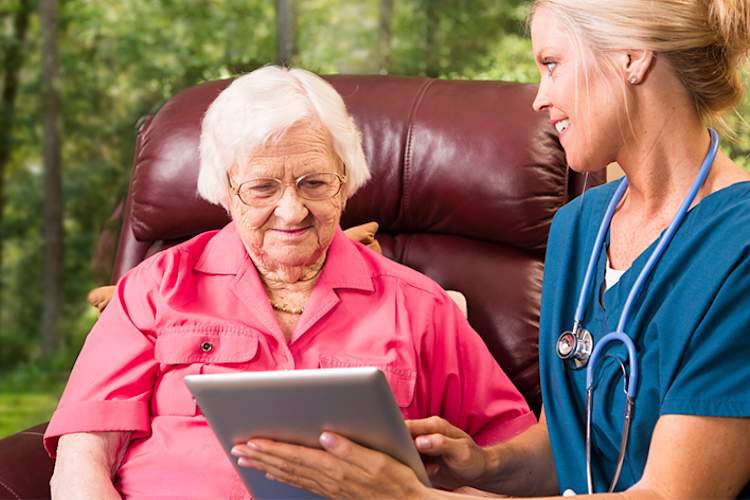 Home health nurse with elderly woman.