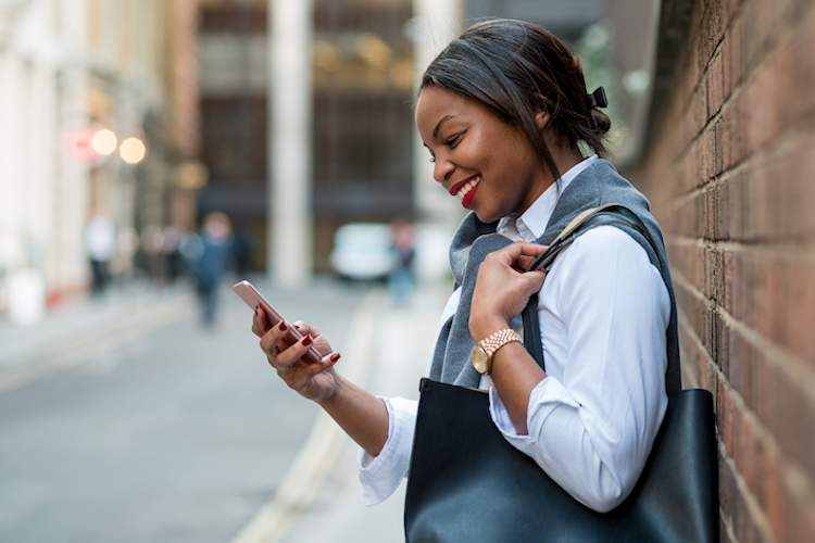 Woman smiling while talking on her phone.