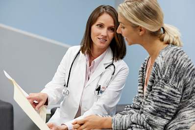 Doctor showing results to a patient.