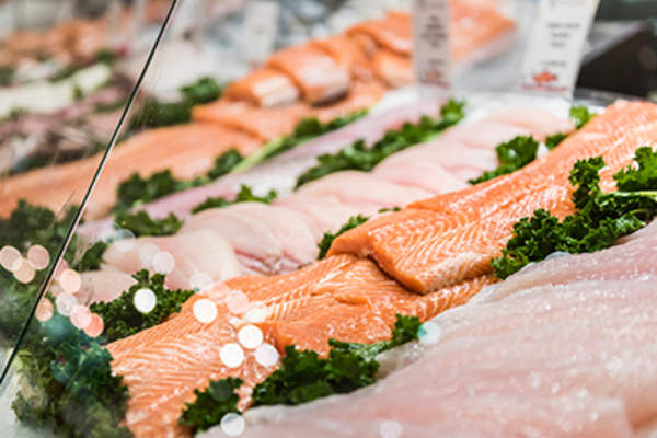 Seafood stand with cuts and filets of salmon and tuna