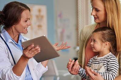 Mother talking to a pediatrician.