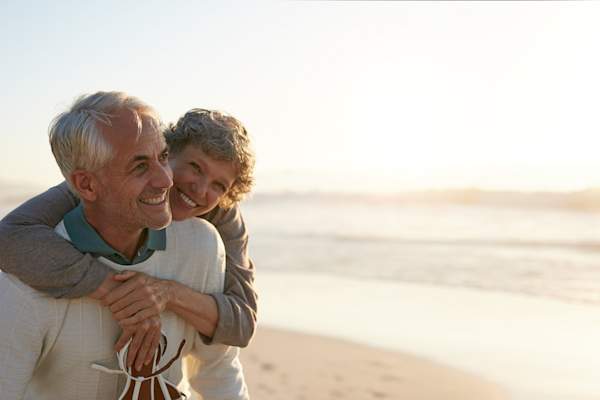 Loving couple on beach.