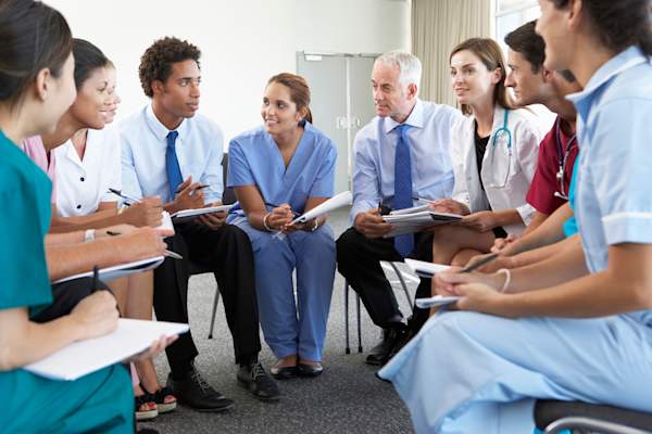 Medical team meeting to coordinate care.