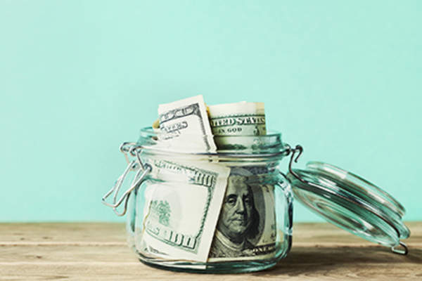 Money in a glass jar.