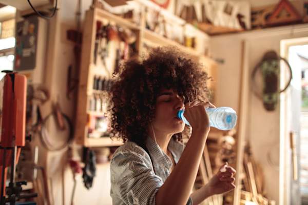 Woman drinking bottle of water
