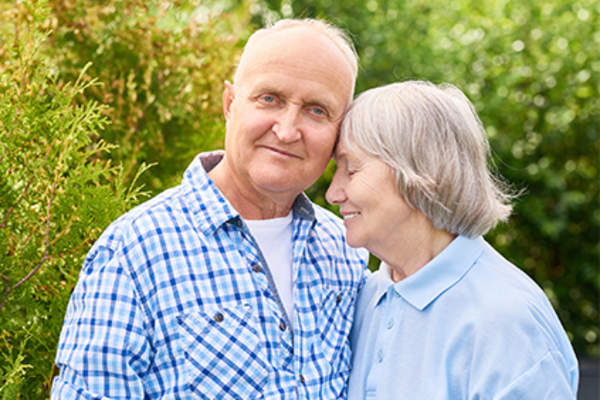 Happy, healthy senior couple outside.