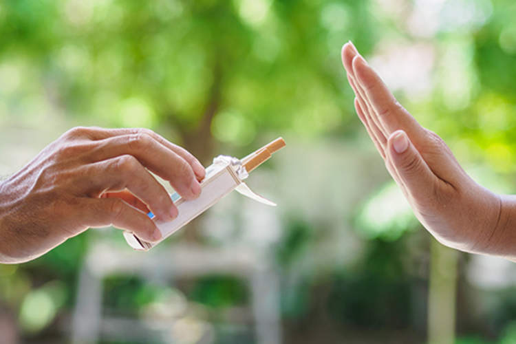 Hand rejecting cigarettes.