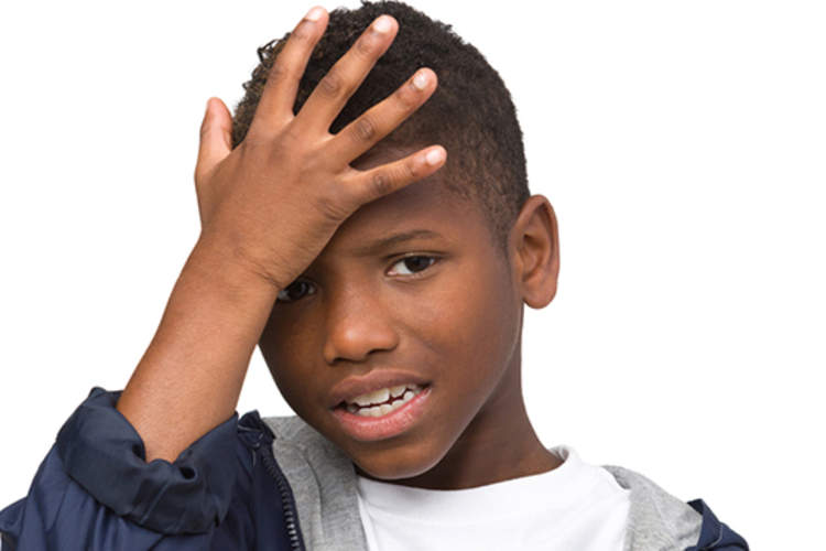 boy with migraine headache image