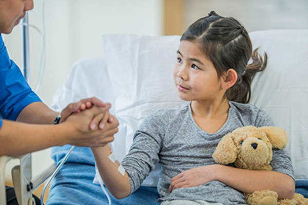 Child with leukemia undergoing chemotherapy treatment.