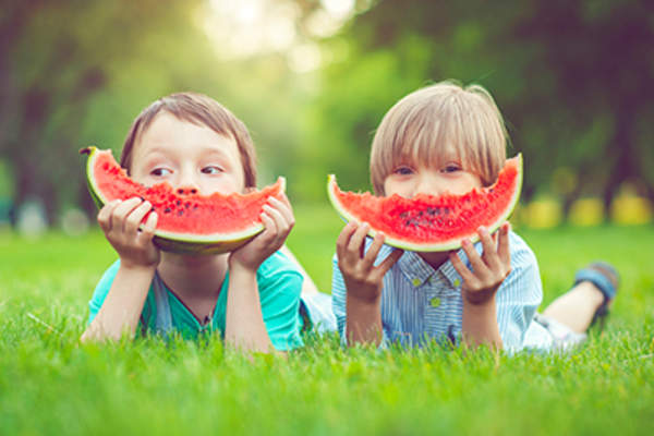 Children eating watermelon