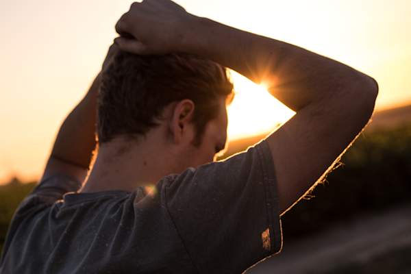 Man with hands on head