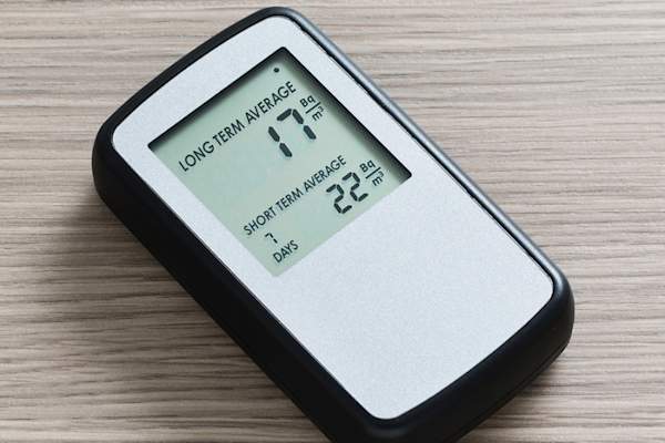 A digital radon detector on a table