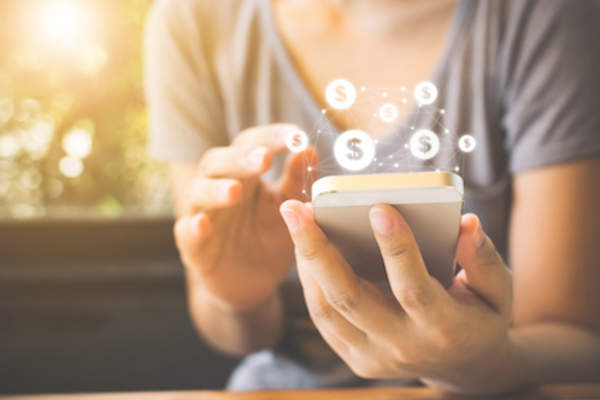 Woman using budgeting application on smartphone.