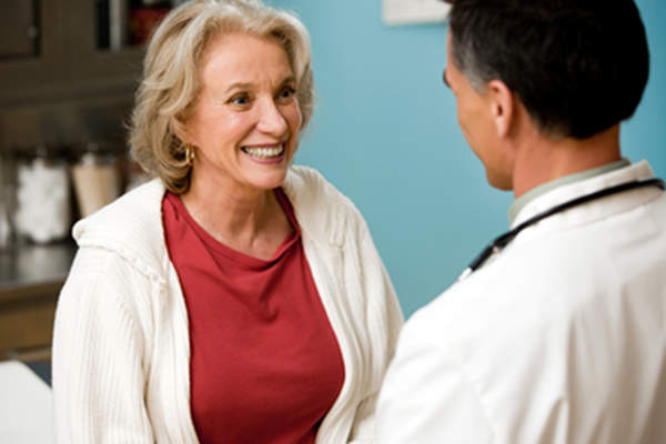 Woman talking to her doctor.