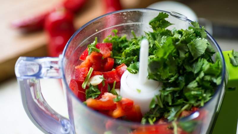 Food processor full of vegetables