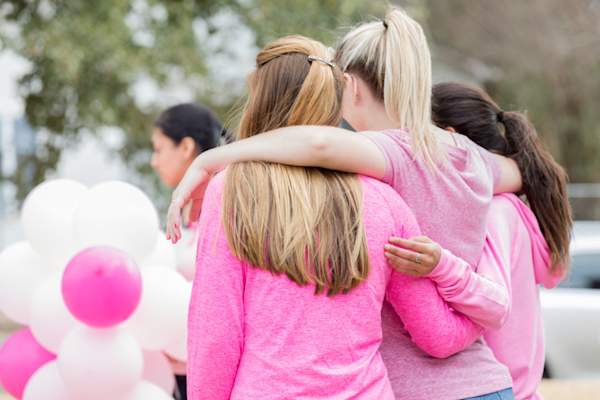 Female friends bond during cancer awareness run